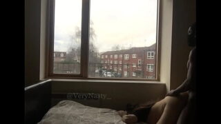 Slut Fucking Bbc Guy by the window for everyone to see